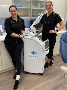 Parkway Dental Staff Pose with the Laser Dentistry Equipment