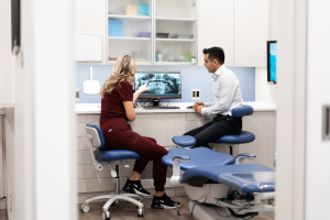 Dentists reviewing a patient's digital x-ray.
