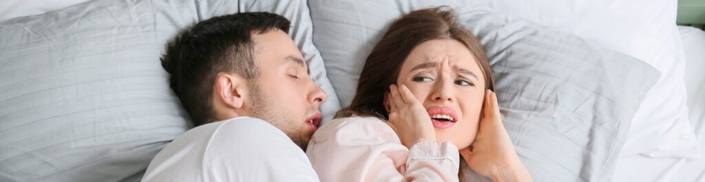 A couple in bed is kept awake from