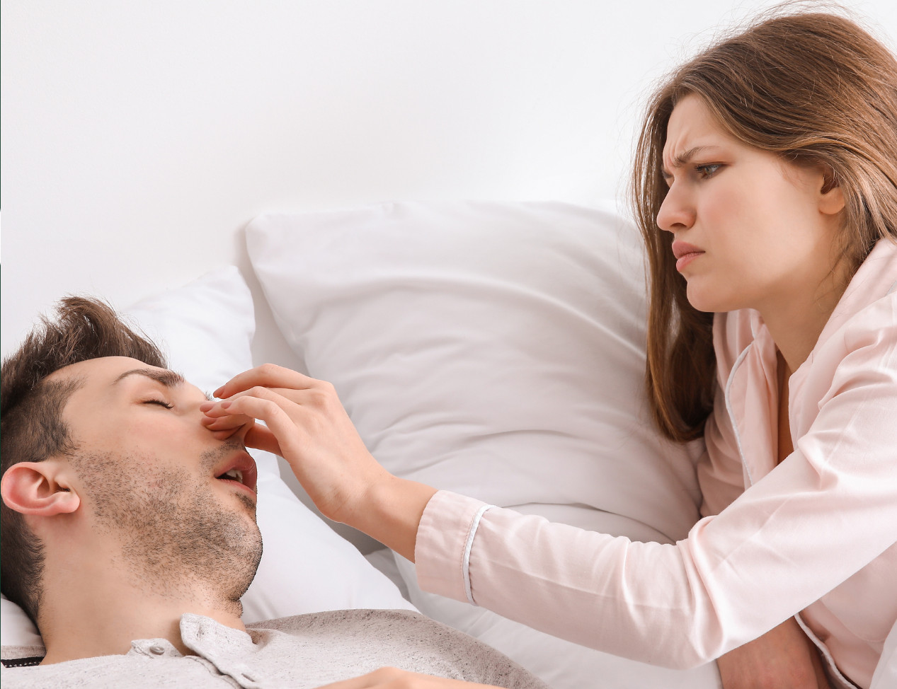 A partner pinches a nose looking for a snore solution in Victoria.