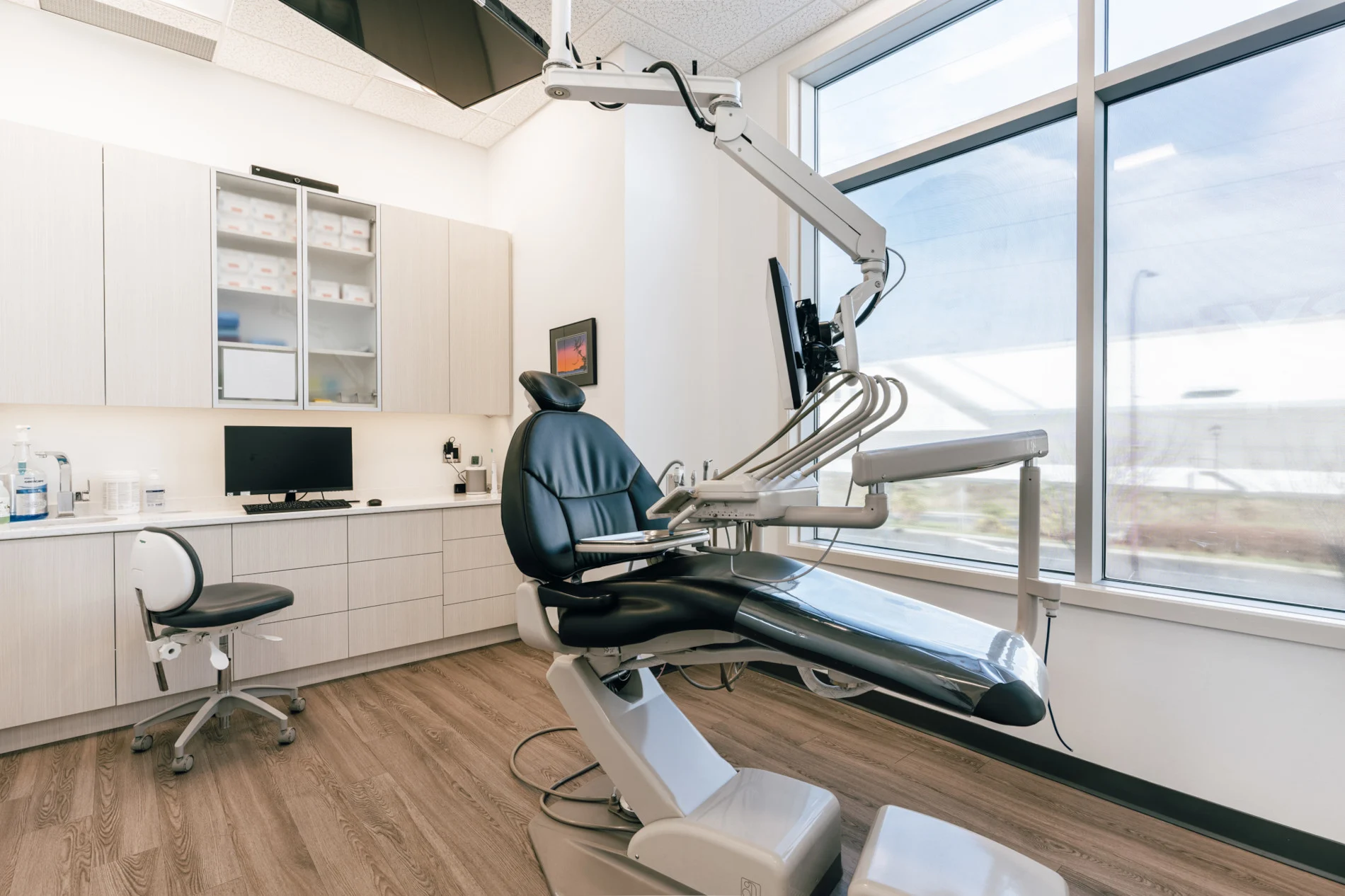 An empty dentist chair in the Parkway Dental office operatory.