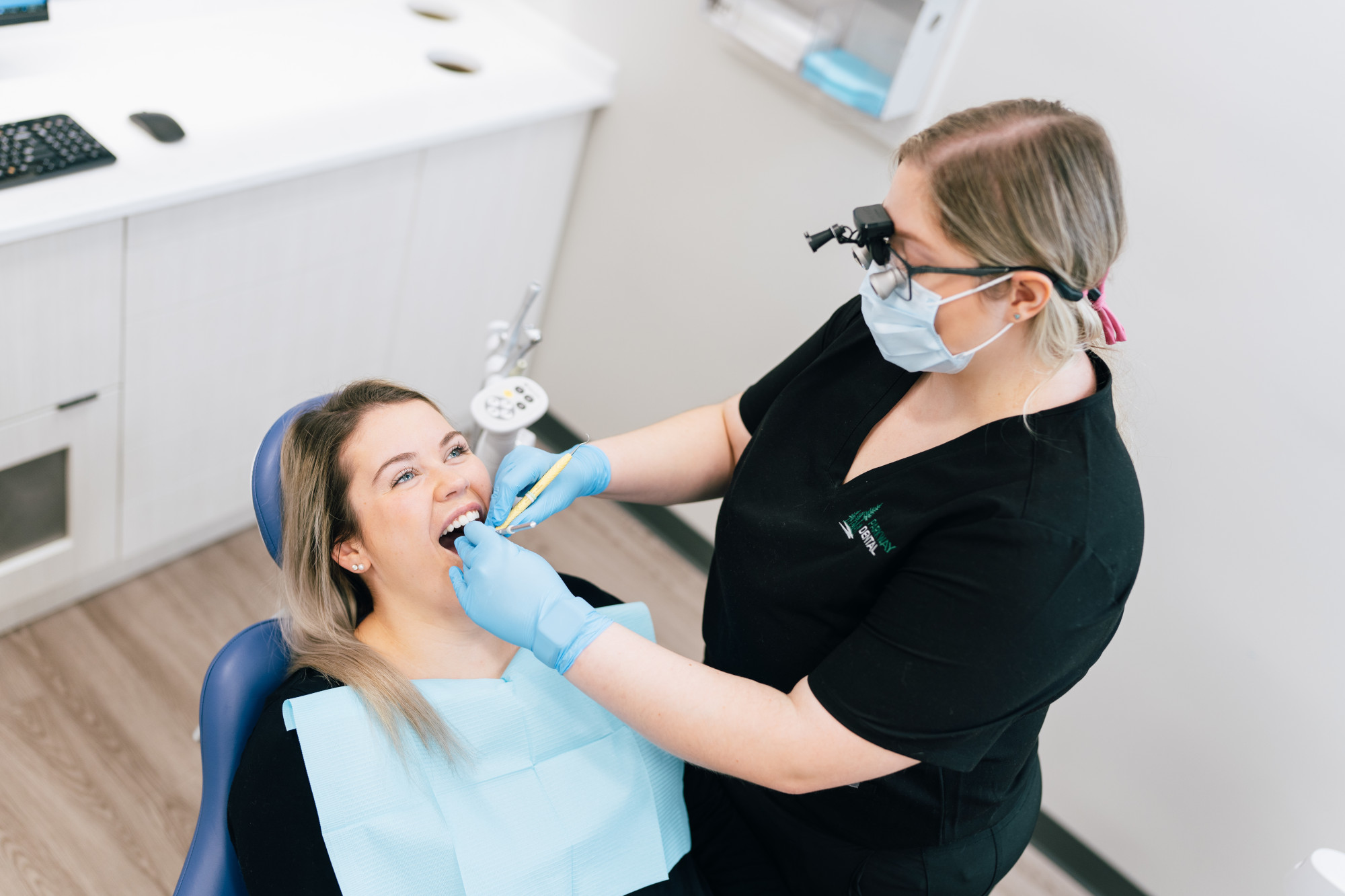 A dental cleaning patient has their teeth worked on by Parkway Dental Dentist