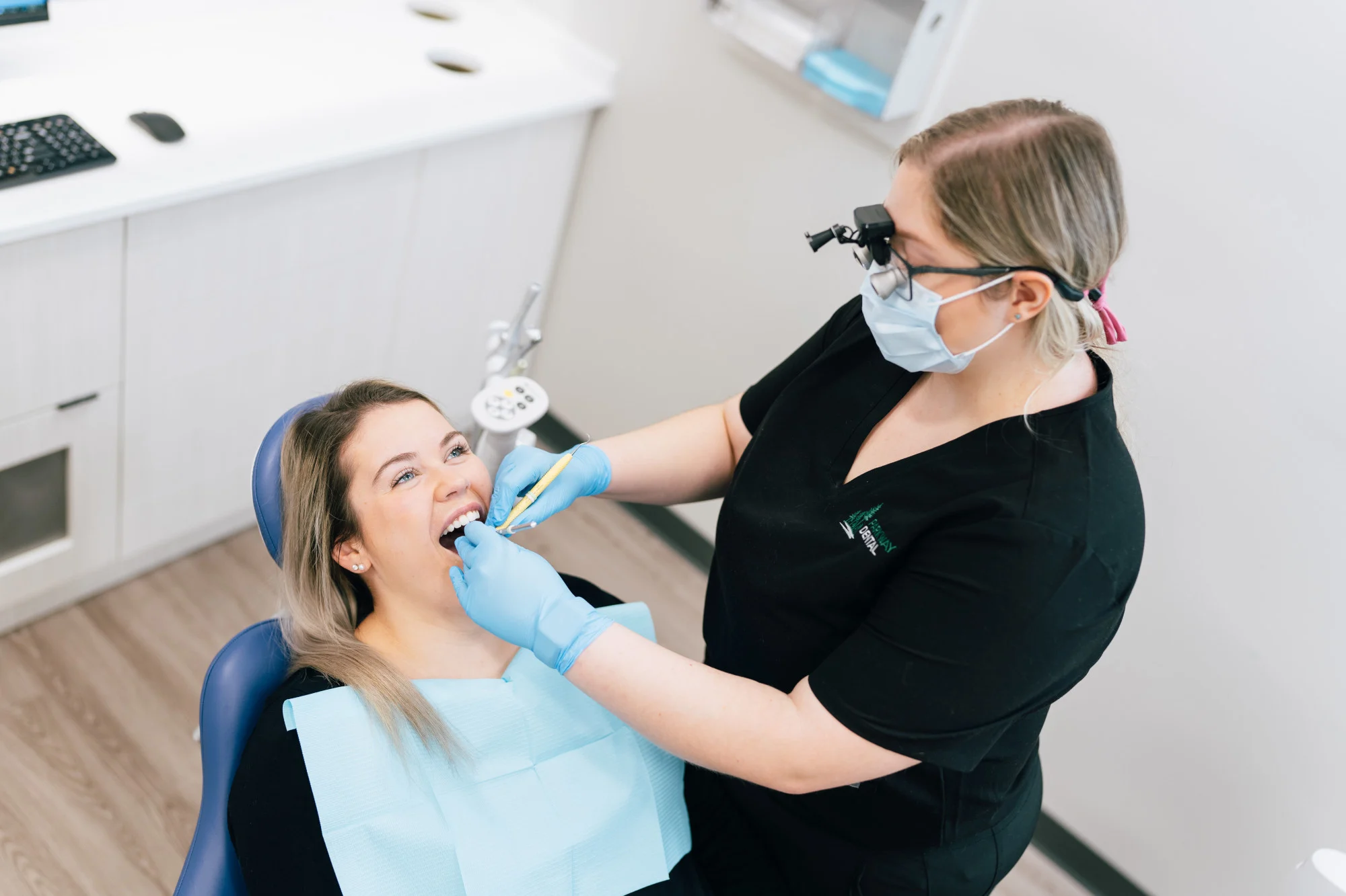 A dental cleaning patient has their teeth worked on by Parkway Dental Dentist